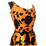 Tangerine orange and black rose silhouette vintage 1950s dress