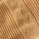 Light amber orange 70s-does-40s ribbed heart motif jumper