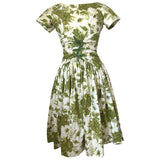 Olive green and white rose print vintage 1950s cotton day dress with bow trim