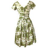 Olive green and white rose print vintage 1950s cotton day dress with bow trim