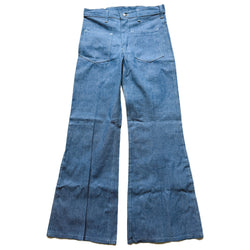 Pair of blue vintage flared jeans on a white background